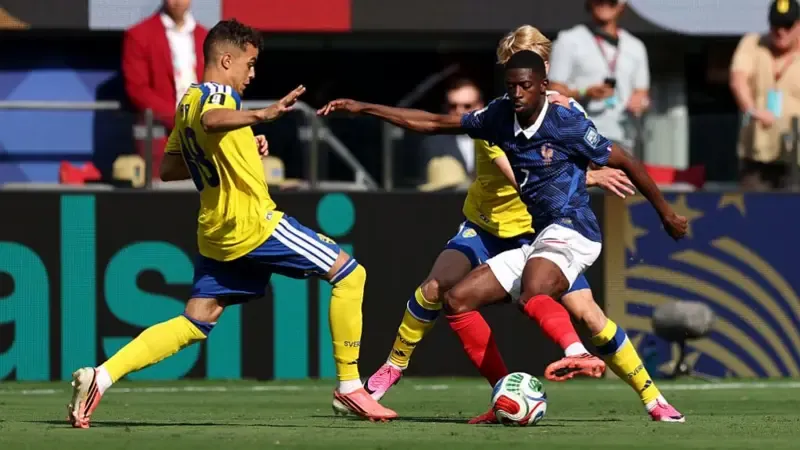 Ousmane Dembele #7 of France controls the ball under pressure from Yasin Ayari #18 of Sweden during the FIFA World Cup 2026 Round Of 32 match between France and Sweden.