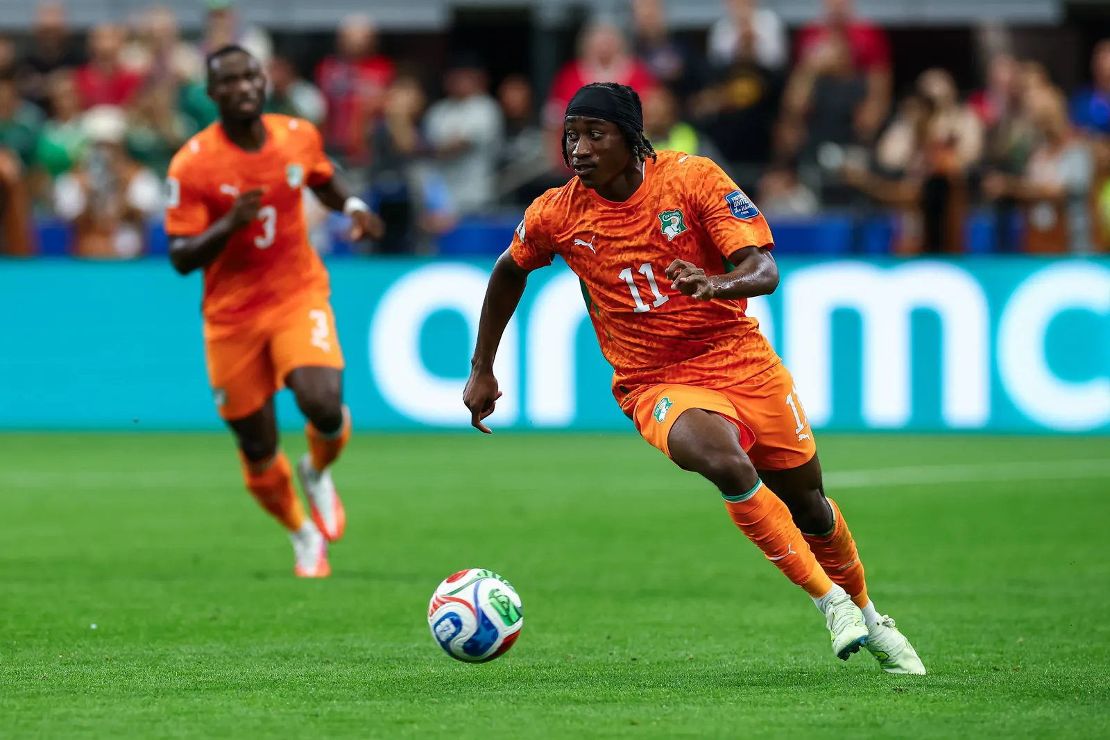 Cote d' Ivoire winger Yan Diomande dribbles up field