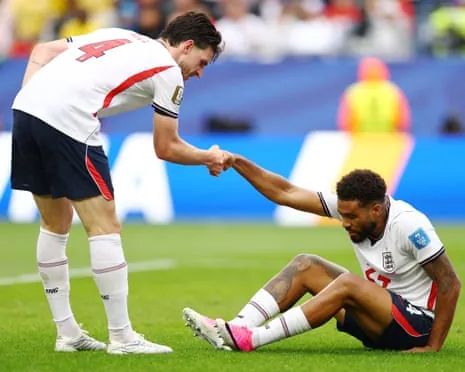 Declan Rice helps Reece James to his feet during England's draw with Ghana