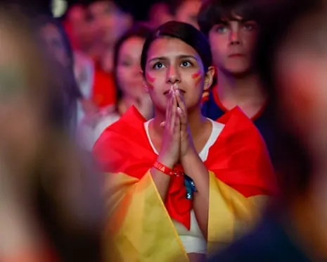 Fans in Madrid watch Spain play Argentina in the World Cup final.